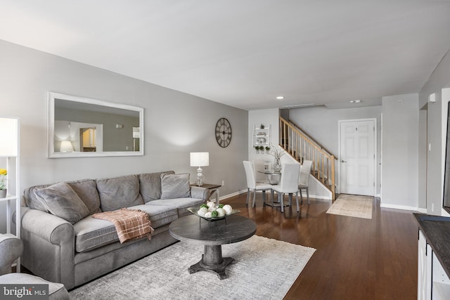 living area featuring stairs, dark wood-style flooring, baseboards, and recessed lighting