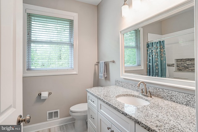 10935 Ravenwood Dr, Manassas, VA 20111 - bathroom with vanity, toilet, a shower with shower curtain, baseboards, and visible vents