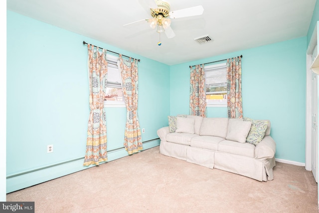sitting room featuring ceiling fan, visible vents, and carpet