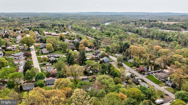 aerial view with a residential view and a wooded view