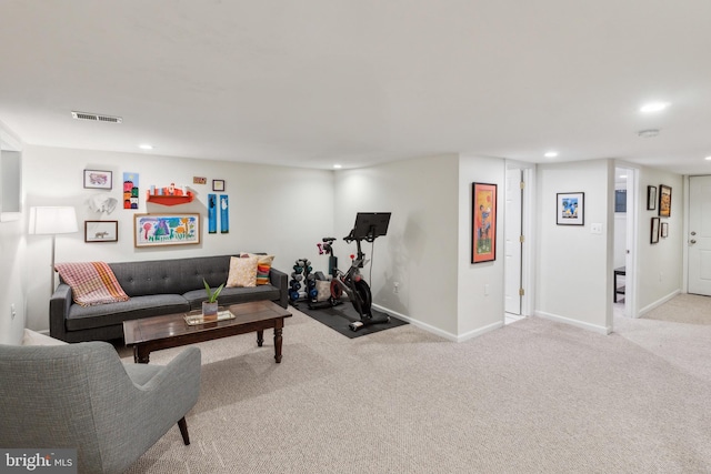 carpeted living area with recessed lighting, baseboards, and visible vents