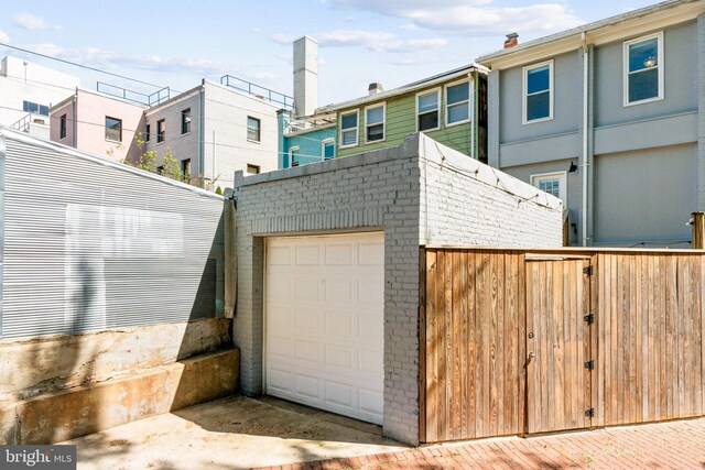 garage with fence