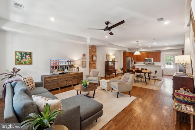 living room with recessed lighting, ceiling fan, visible vents, and wood finished floors