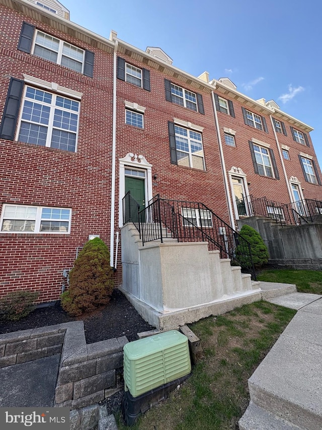 exterior space featuring brick siding