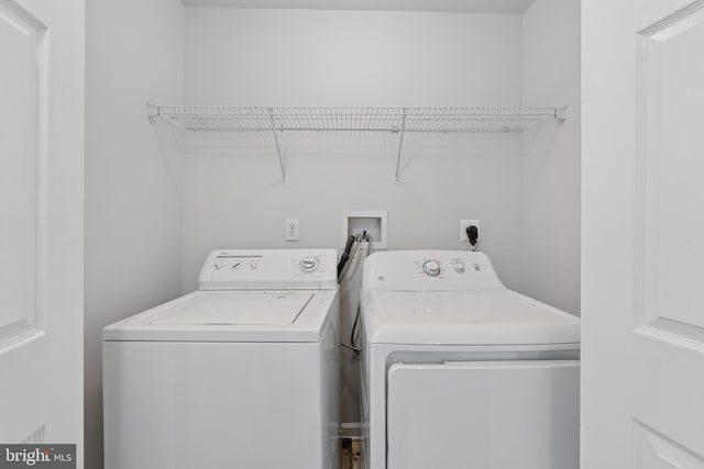 laundry room with laundry area and separate washer and dryer