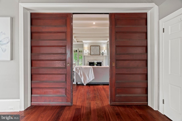 detailed view of wood finished floors and a fireplace