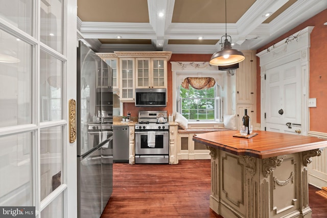 kitchen with stainless steel appliances, wood counters, crown molding, coffered ceiling, and dark wood-type flooring