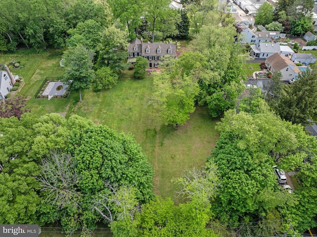 aerial view of property and surrounding area with nearby suburban area