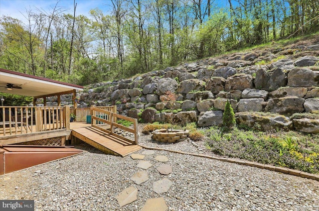 view of patio / terrace featuring ceiling fan and a deck