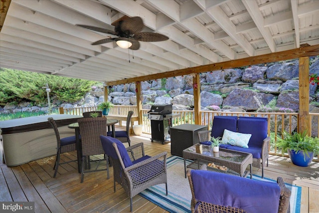 deck with outdoor dining area, a ceiling fan, outdoor lounge area, and area for grilling