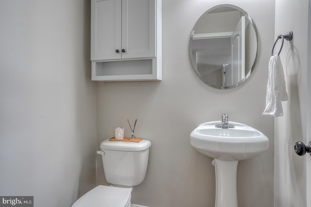 half bathroom with toilet