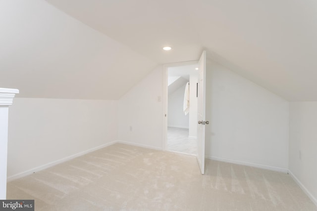 additional living space featuring lofted ceiling, recessed lighting, carpet flooring, and baseboards