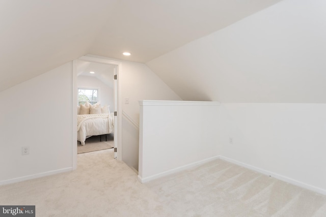 bonus room featuring recessed lighting, vaulted ceiling, carpet, and baseboards