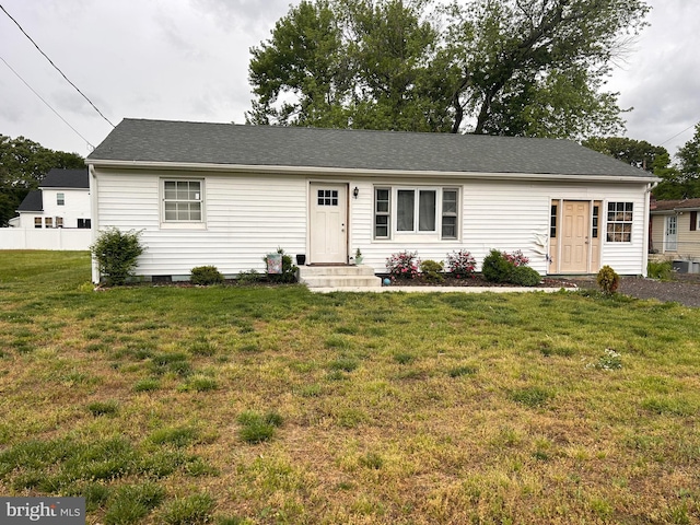 ranch-style house featuring a front lawn