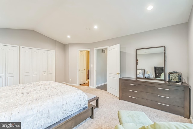 bedroom with recessed lighting, multiple closets, vaulted ceiling, carpet flooring, and baseboards