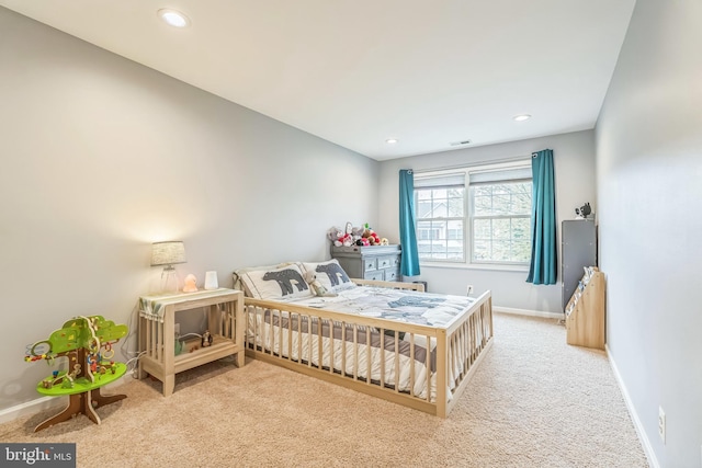 bedroom with recessed lighting, carpet flooring, and baseboards