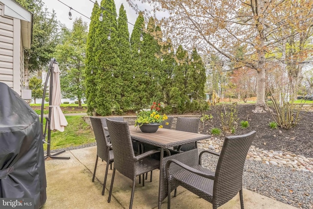 view of patio featuring a grill and outdoor dining area