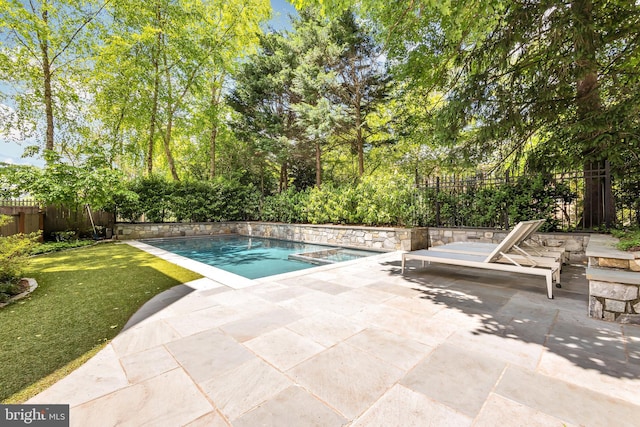 view of pool featuring a fenced in pool, a fenced backyard, a yard, and a patio area