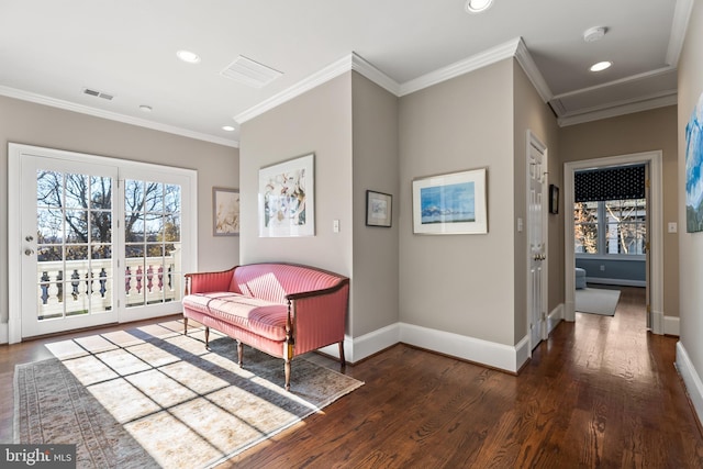sitting room with recessed lighting, wood finished floors, ornamental molding, baseboards, and visible vents