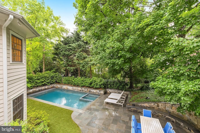view of pool with a patio, fence, and a fenced in pool