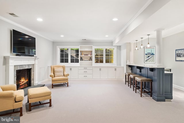 interior space featuring carpet flooring, a premium fireplace, visible vents, baseboards, and ornamental molding