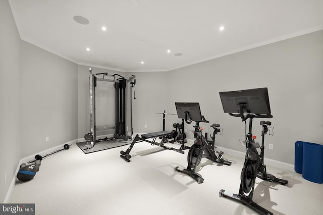 exercise room featuring baseboards, recessed lighting, and ornamental molding