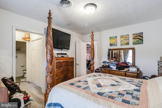 5135 Clark Canning House Rd, Federalsburg, MD 21632 - carpeted bedroom featuring a textured ceiling and ensuite bath