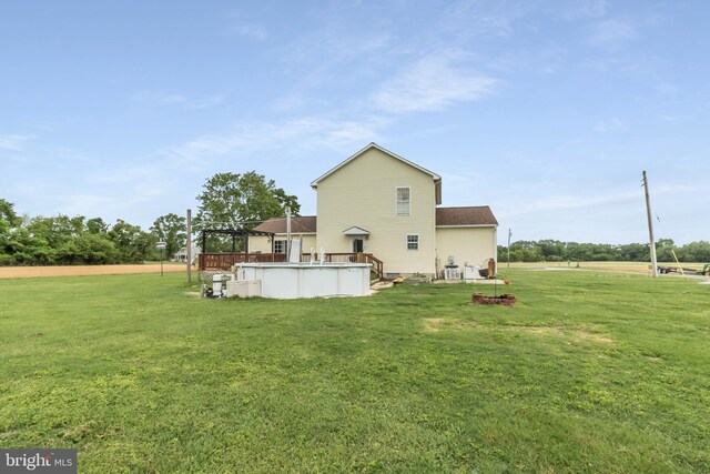 5135 Clark Canning House Rd, Federalsburg, MD 21632 - rear view of property featuring a lawn, an outdoor pool, and a deck