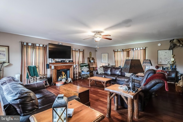 5135 Clark Canning House Rd, Federalsburg, MD 21632 - living room featuring a ceiling fan, wood finished floors, and a lit fireplace
