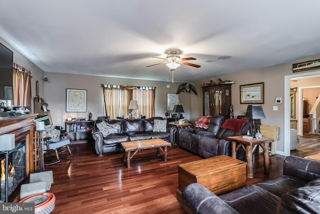 5135 Clark Canning House Rd, Federalsburg, MD 21632 - living room with ceiling fan, wood finished floors, and a lit fireplace