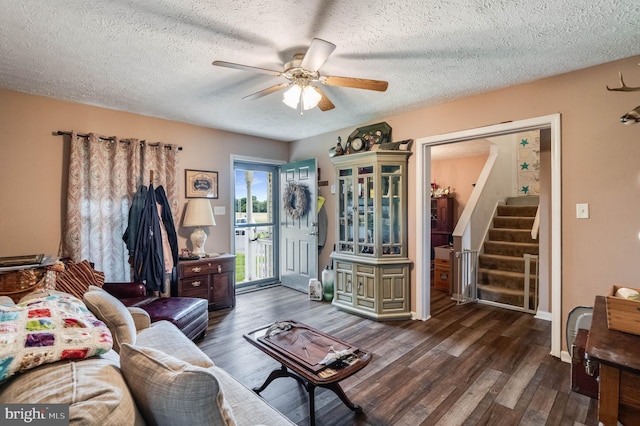 5135 Clark Canning House Rd, Federalsburg, MD 21632 - living area with a ceiling fan, wood finished floors, stairs, and a textured ceiling