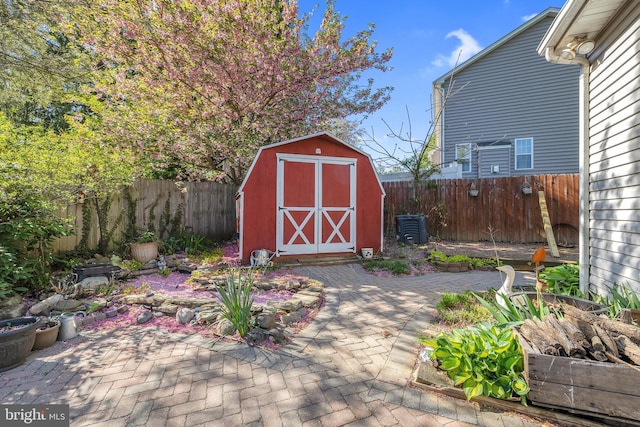 view of shed with a fenced backyard