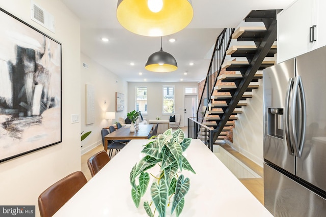 2131 Wharton St, Philadelphia, PA 19146 - dining room featuring visible vents, wood finished floors, stairway, baseboards, and recessed lighting
