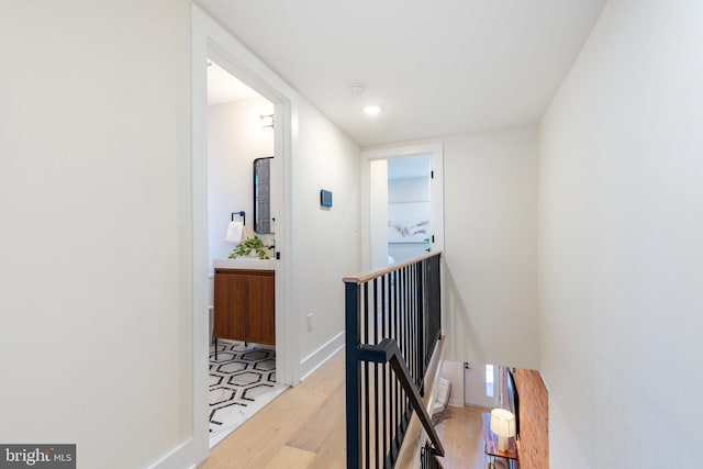 2131 Wharton St, Philadelphia, PA 19146 - hallway with baseboards, an upstairs landing, and light wood finished floors
