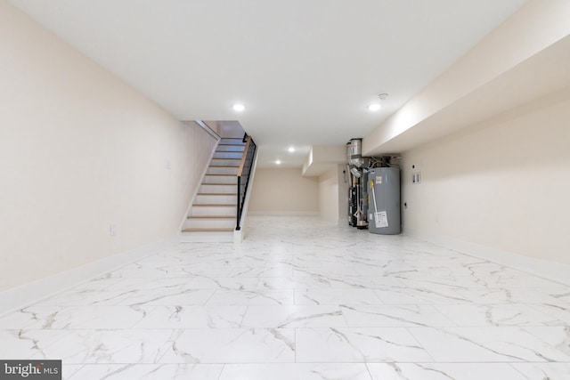 2131 Wharton St, Philadelphia, PA 19146 - finished basement featuring stairs, baseboards, marble finish floor, water heater, and recessed lighting