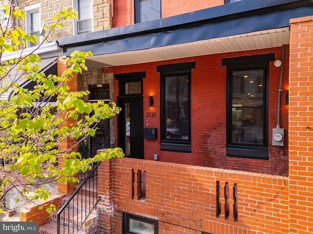 2131 Wharton St, Philadelphia, PA 19146 - view of exterior entry with a porch and brick siding