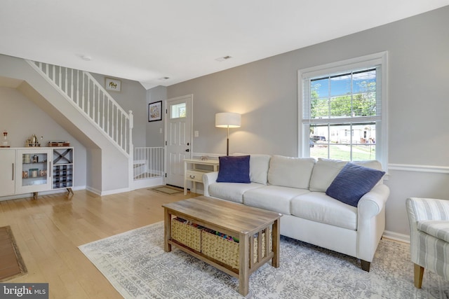 6825 Kincaid Ave, Falls Church, VA 22042 - living room featuring baseboards, a wealth of natural light, wood finished floors, and stairway
