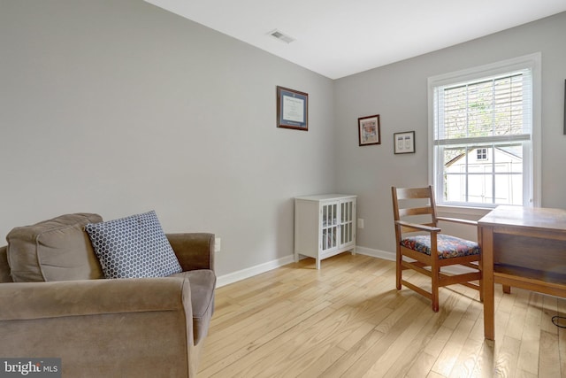 6825 Kincaid Ave, Falls Church, VA 22042 - living area featuring visible vents, light wood-style flooring, and baseboards