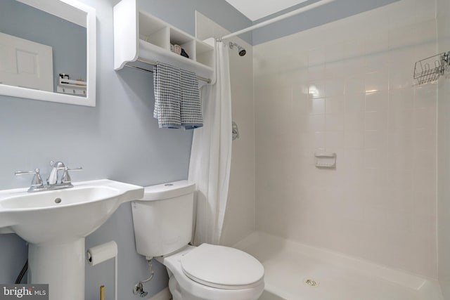 6825 Kincaid Ave, Falls Church, VA 22042 - bathroom featuring toilet, a sink, and a stall shower