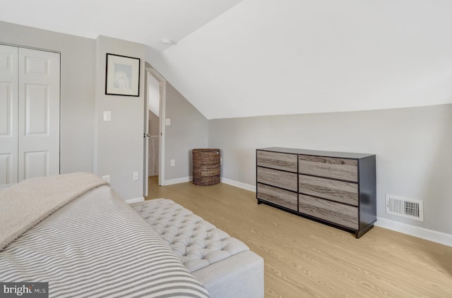 6825 Kincaid Ave, Falls Church, VA 22042 - bedroom with visible vents, vaulted ceiling, wood finished floors, baseboards, and a closet