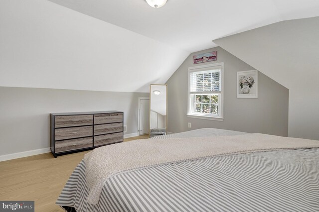 6825 Kincaid Ave, Falls Church, VA 22042 - bedroom featuring baseboards, lofted ceiling, and light wood-style floors