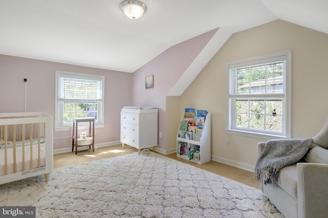 6825 Kincaid Ave, Falls Church, VA 22042 - bedroom with baseboards, wood finished floors, and vaulted ceiling