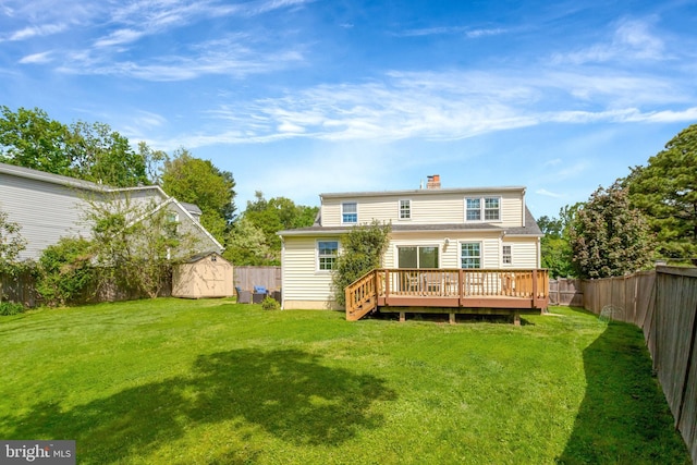 6825 Kincaid Ave, Falls Church, VA 22042 - back of house featuring a fenced backyard, a wooden deck, a lawn, and a shed