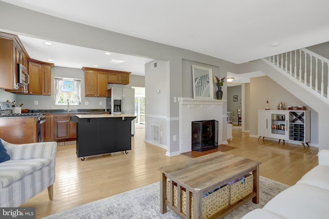 6825 Kincaid Ave, Falls Church, VA 22042 - living area featuring light wood-style flooring, stairs, recessed lighting, baseboards, and visible vents