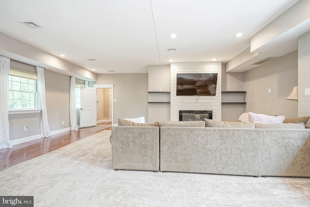 11 Lippincott Ave, Voorhees, NJ 08043 - living room featuring visible vents, recessed lighting, wood finished floors, and a fireplace