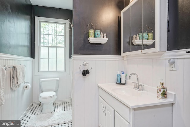 11 Lippincott Ave, Voorhees, NJ 08043 - bathroom with vanity, a decorative wall, a wainscoted wall, and toilet