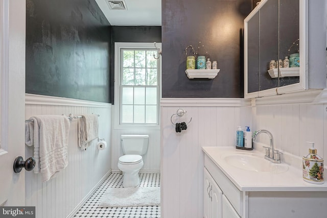 11 Lippincott Ave, Voorhees, NJ 08043 - bathroom featuring vanity, toilet, visible vents, and a wainscoted wall
