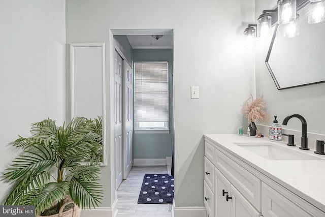 11 Lippincott Ave, Voorhees, NJ 08043 - bathroom with vanity, baseboards, and wood finished floors