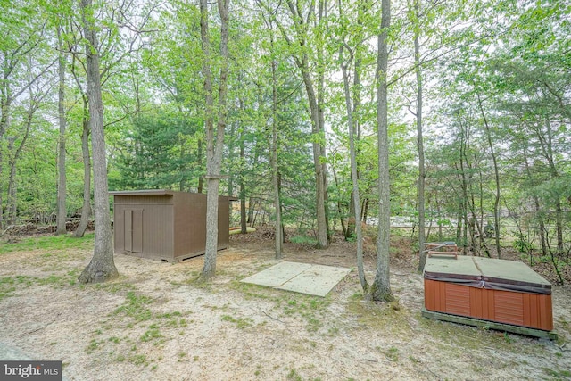 11 Lippincott Ave, Voorhees, NJ 08043 - view of yard featuring a hot tub, an outbuilding, and a storage shed