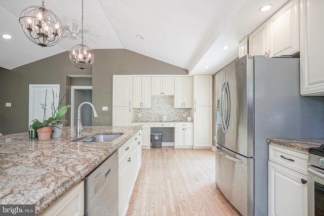 11 Lippincott Ave, Voorhees, NJ 08043 - kitchen with a notable chandelier, appliances with stainless steel finishes, a sink, light wood finished floors, and lofted ceiling